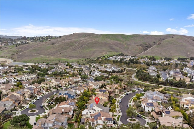 12 John, Ladera Ranch, CA 92694 - aerial overview of property's location featuring nearby suburban area and a mountain backdrop