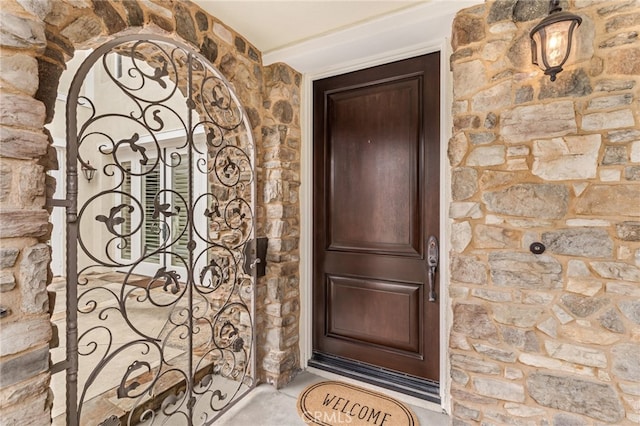 12 John, Ladera Ranch, CA 92694 - doorway to property with stone siding and a gate