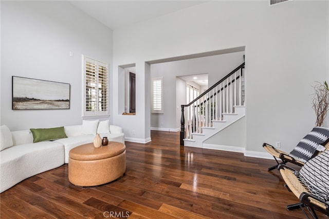 12 John, Ladera Ranch, CA 92694 - living room with hardwood / wood-style flooring, baseboards, stairway, and a high ceiling