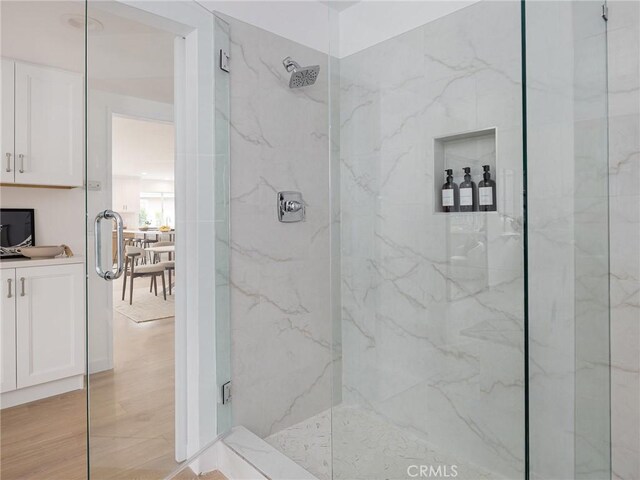 4918 Delacroix Rd, Rancho Palos Verdes, CA 90275 - bathroom with a marble finish shower, vanity, and wood finished floors