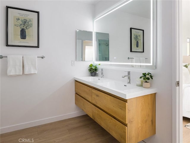 4918 Delacroix Rd, Rancho Palos Verdes, CA 90275 - bathroom featuring double vanity, wood finished floors, and a shower