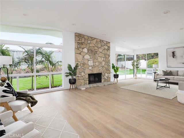 4918 Delacroix Rd, Rancho Palos Verdes, CA 90275 - living area featuring wood finished floors, lofted ceiling, and a stone fireplace