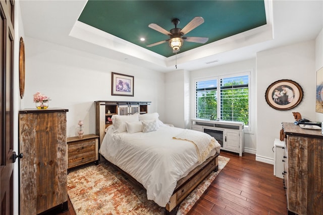45166 Oak Manor Ct, Temecula, CA 92590 - bedroom featuring a raised ceiling, dark wood-style floors, baseboards, a ceiling fan, and ornamental molding