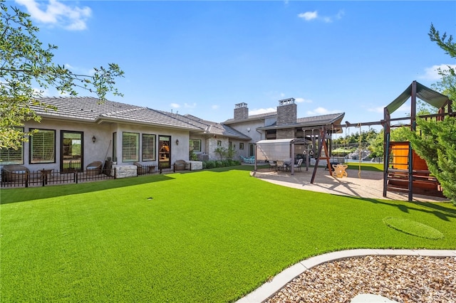 45166 Oak Manor Ct, Temecula, CA 92590 - rear view of house with a playground, stucco siding, a tiled roof, and a patio area