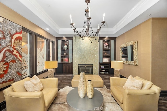 451 W Le Roy Ave, Arcadia, CA 91007 - living area with a tray ceiling, a chandelier, crown molding, built in shelves, and a fireplace