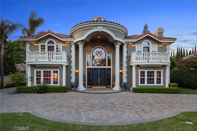 451 W Le Roy Ave, Arcadia, CA 91007 - view of front of home with a balcony, a chimney, stucco siding, and a tile roof