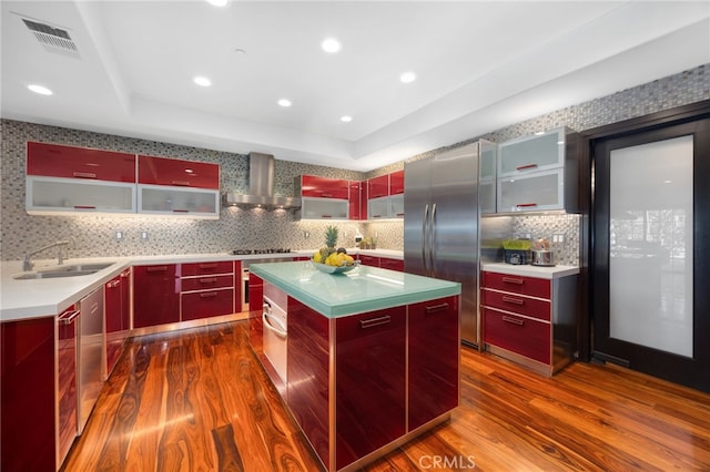 451 W Le Roy Ave, Arcadia, CA 91007 - kitchen featuring a sink, red cabinets, wall chimney range hood, dark wood-type flooring, and recessed lighting
