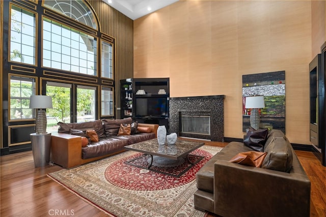 451 W Le Roy Ave, Arcadia, CA 91007 - living area featuring a high ceiling, wood finished floors, and a fireplace