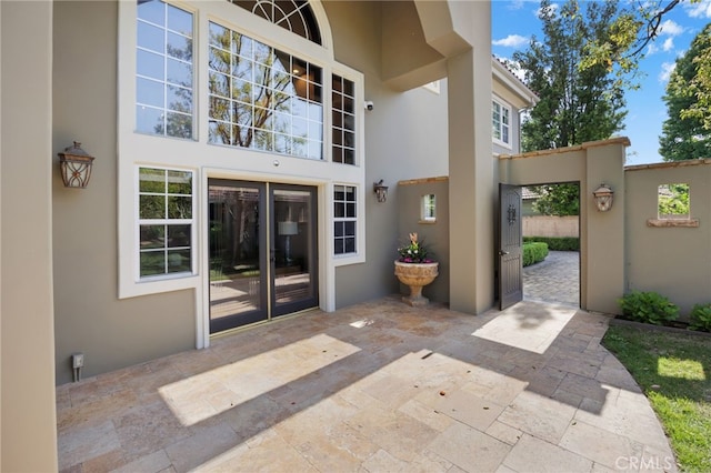 451 W Le Roy Ave, Arcadia, CA 91007 - view of exterior entry with stucco siding and a patio