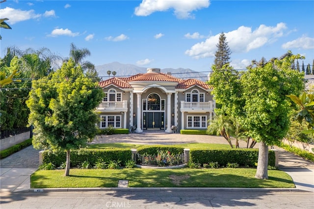 451 W Le Roy Ave, Arcadia, CA 91007 - mediterranean / spanish-style home with a tile roof, a balcony, stucco siding, and a mountain view