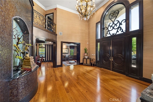 451 W Le Roy Ave, Arcadia, CA 91007 - entrance foyer featuring wood finished floors, a high ceiling, a chandelier, and crown molding