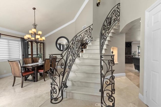 5131 Via Del Valle St, La Verne, CA 91750 - stairway with arched walkways, ornamental molding, a chandelier, baseboards, and tile patterned flooring