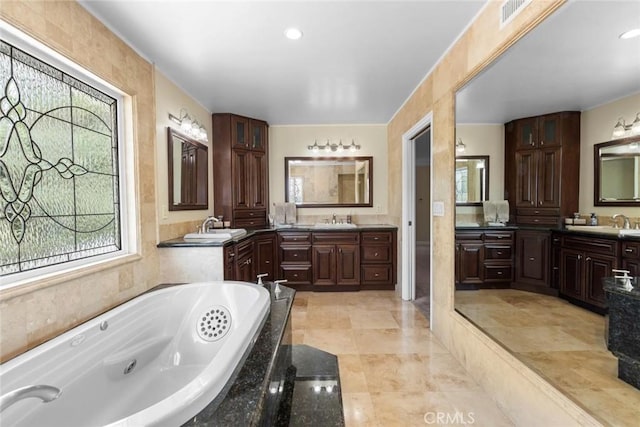 5131 Via Del Valle St, La Verne, CA 91750 - bathroom featuring healthy amount of natural light, two vanities, and a jetted tub