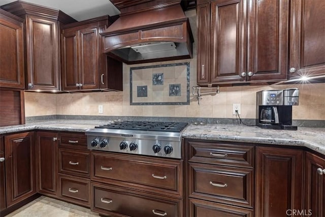 5131 Via Del Valle St, La Verne, CA 91750 - kitchen with custom range hood, stainless steel gas cooktop, light stone counters, tasteful backsplash, and dark brown cabinets