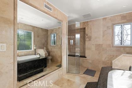 5131 Via Del Valle St, La Verne, CA 91750 - bathroom featuring tile walls, a garden tub, toilet, tile patterned floors, and a stall shower
