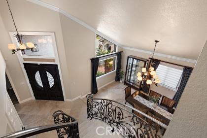 5131 Via Del Valle St, La Verne, CA 91750 - entrance foyer with a chandelier, crown molding, and baseboards