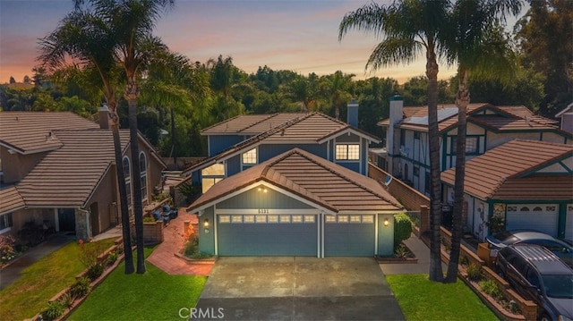 5131 Via Del Valle St, La Verne, CA 91750 - view of front of property featuring driveway, a tile roof, and a yard