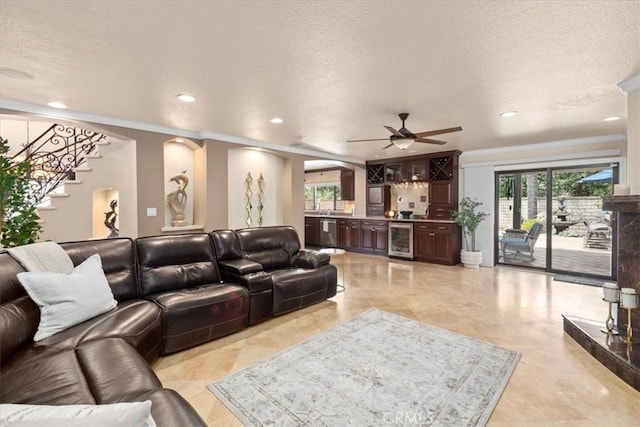 5131 Via Del Valle St, La Verne, CA 91750 - living area with beverage cooler, crown molding, a ceiling fan, recessed lighting, and healthy amount of natural light