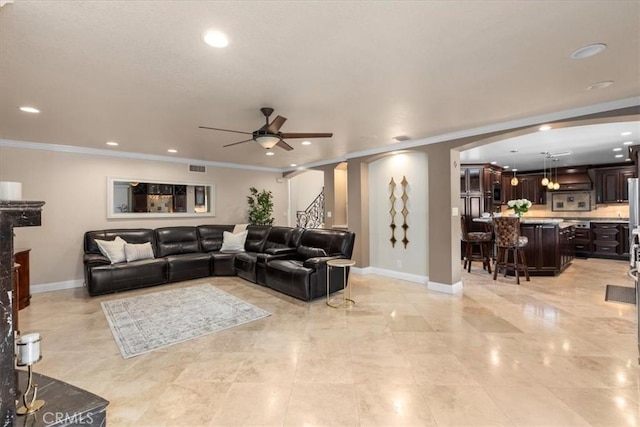 5131 Via Del Valle St, La Verne, CA 91750 - living room with a ceiling fan, arched walkways, baseboards, crown molding, and recessed lighting
