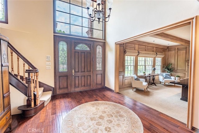 25578 Via Paladar, Valencia, CA 91355 - entrance foyer with dark wood finished floors, a chandelier, a towering ceiling, and stairway