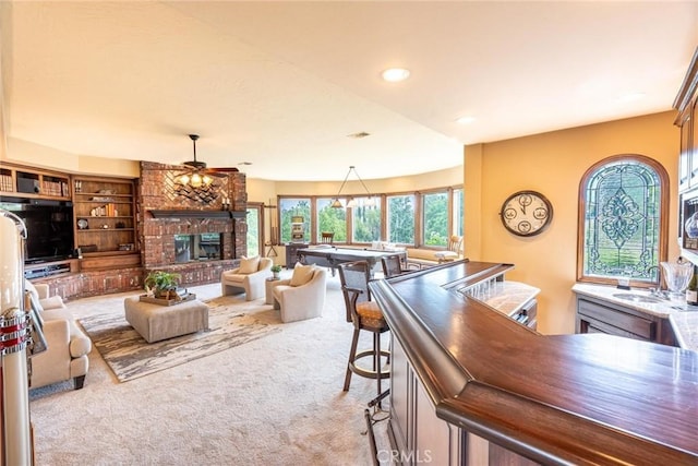 25578 Via Paladar, Valencia, CA 91355 - living room with carpet flooring, a brick fireplace, a ceiling fan, and recessed lighting
