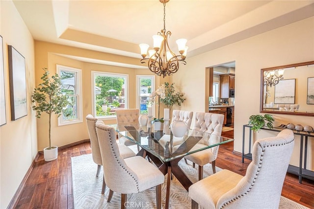 25578 Via Paladar, Valencia, CA 91355 - dining room featuring a chandelier, dark wood-type flooring, and a tray ceiling