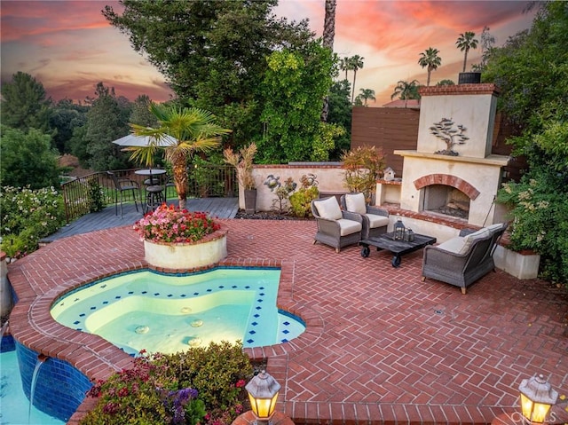 25578 Via Paladar, Valencia, CA 91355 - view of swimming pool with a patio area and an outdoor living space with a fireplace