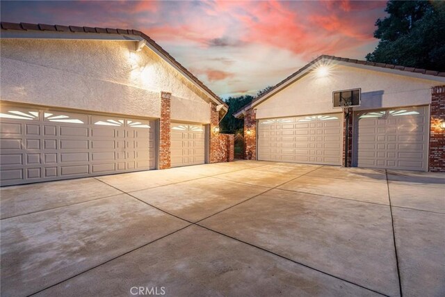 25578 Via Paladar, Valencia, CA 91355 - garage at dusk with a garage