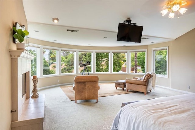 25578 Via Paladar, Valencia, CA 91355 - bedroom with light colored carpet, multiple windows, and a premium fireplace