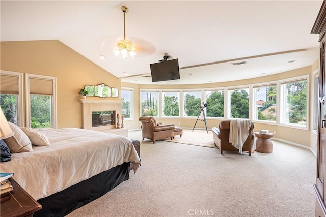 25578 Via Paladar, Valencia, CA 91355 - bedroom with carpet flooring, multiple windows, lofted ceiling, and a glass covered fireplace