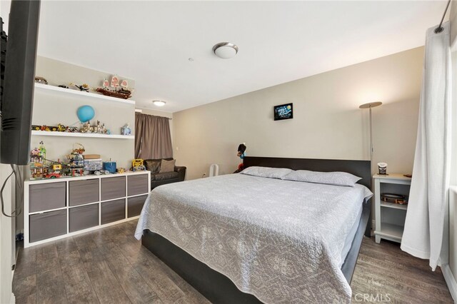 7021 Passons Blvd, Pico Rivera, CA 90660 - bedroom with dark wood-type flooring