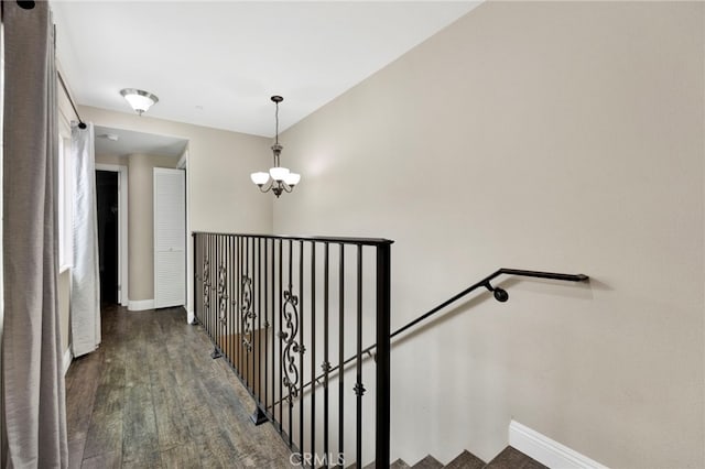 7021 Passons Blvd, Pico Rivera, CA 90660 - stairs with wood finished floors and a chandelier