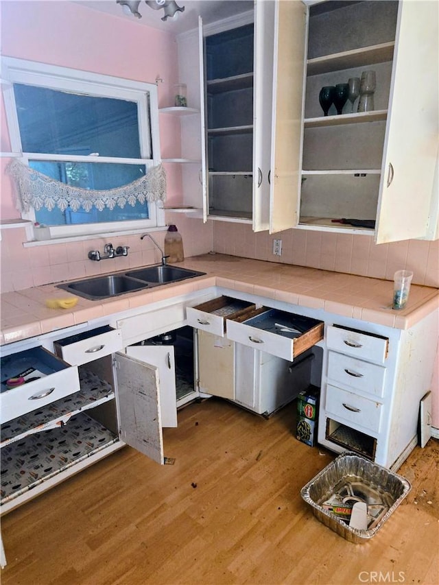 500 E Longden Ave, Arcadia, CA 91006 - kitchen featuring a sink, decorative backsplash, open shelves, light wood-style flooring, and white cabinets