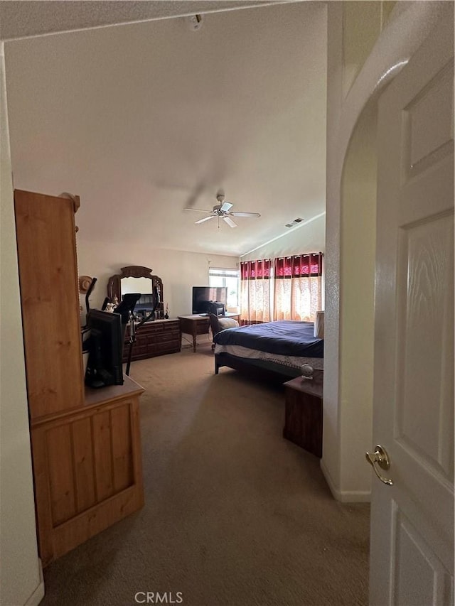 1612 Via Colabria, Gustine, CA 95322 - carpeted bedroom with lofted ceiling, arched walkways, and a ceiling fan