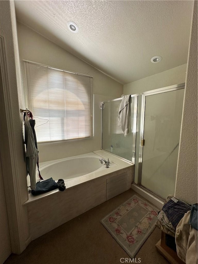 1612 Via Colabria, Gustine, CA 95322 - bathroom with a shower stall, a garden tub, a textured ceiling, vaulted ceiling, and recessed lighting