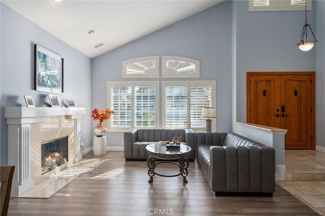9534 Tivoli Cir, Cypress, CA 90630 - living area featuring high vaulted ceiling, baseboards, a fireplace, wood finished floors, and recessed lighting