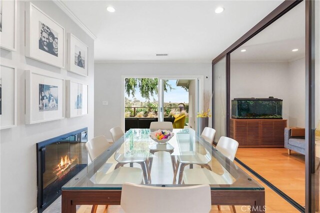 27642 Avenida Del Mesa, Rancho Palos Verdes, CA 90275 - dining room with ornamental molding, recessed lighting, wood finished floors, and a glass covered fireplace