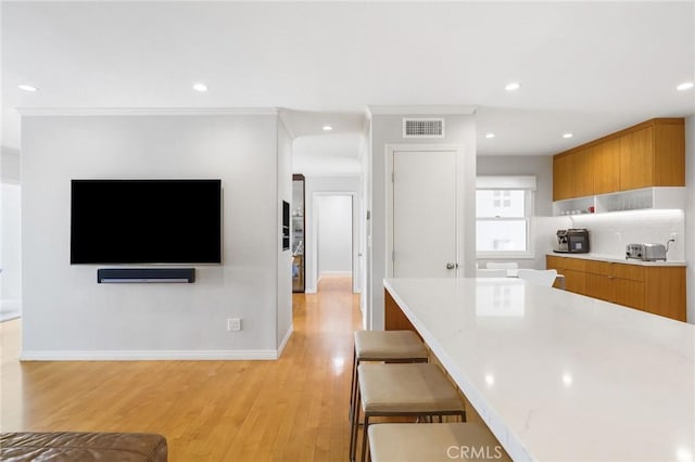 27642 Avenida Del Mesa, Rancho Palos Verdes, CA 90275 - kitchen with brown cabinetry, light countertops, light wood finished floors, modern cabinets, and recessed lighting