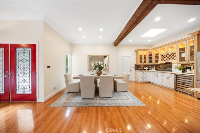 12 Rockrose Way, Irvine, CA 92612 - dining area featuring light wood-style flooring, ornamental molding, baseboards, recessed lighting, and beverage cooler