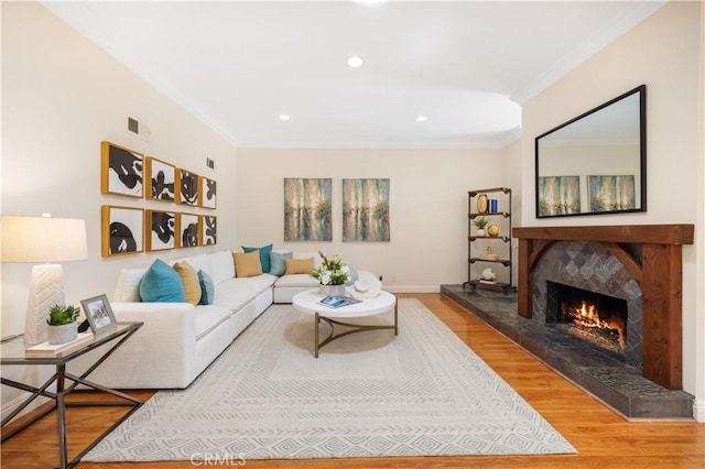 12 Rockrose Way, Irvine, CA 92612 - living room with crown molding, wood finished floors, a premium fireplace, recessed lighting, and baseboards