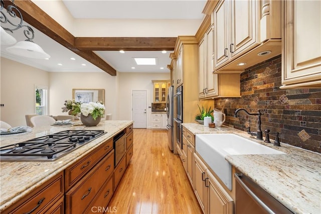 12 Rockrose Way, Irvine, CA 92612 - kitchen featuring stainless steel appliances, a sink, light wood-style flooring, light stone counters, and recessed lighting