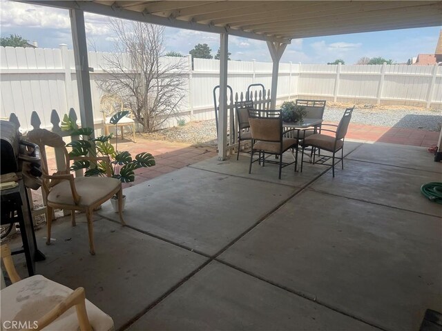 14376 Rivers Edge Rd, Helendale, CA 92342 - fenced backyard with outdoor dining space and a patio area