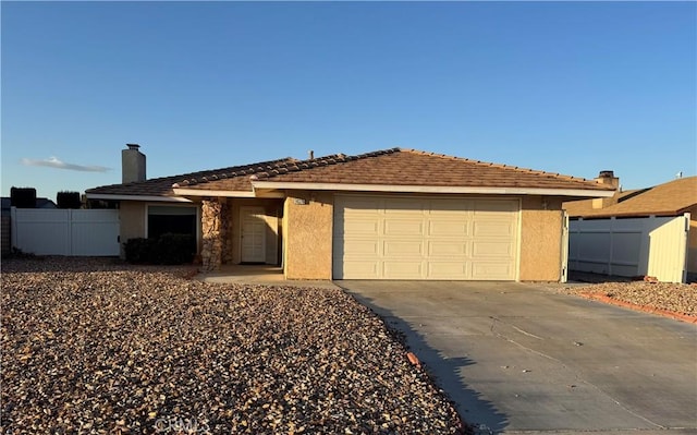 14376 Rivers Edge Rd, Helendale, CA 92342 - single story home featuring stucco siding, a garage, driveway, and a chimney