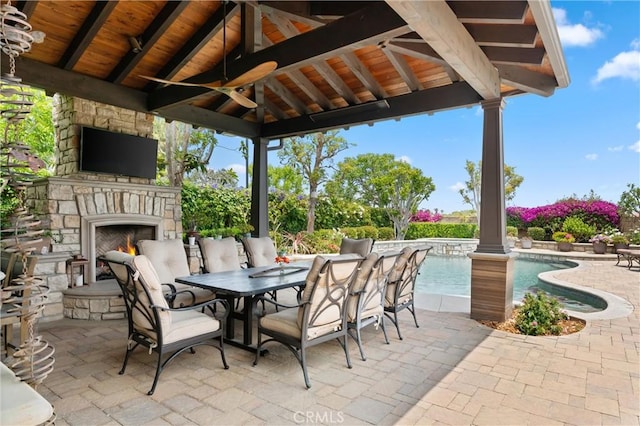 18912 Rockinghorse Ln, Huntington Beach, CA 92648 - view of patio / terrace featuring an outdoor stone fireplace, ceiling fan, and an outdoor pool