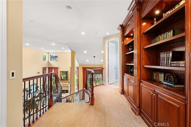 18912 Rockinghorse Ln, Huntington Beach, CA 92648 - hallway featuring an upstairs landing, light colored carpet, and recessed lighting