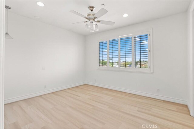 18912 Rockinghorse Ln, Huntington Beach, CA 92648 - unfurnished room with light wood-style floors, ceiling fan, recessed lighting, and baseboards