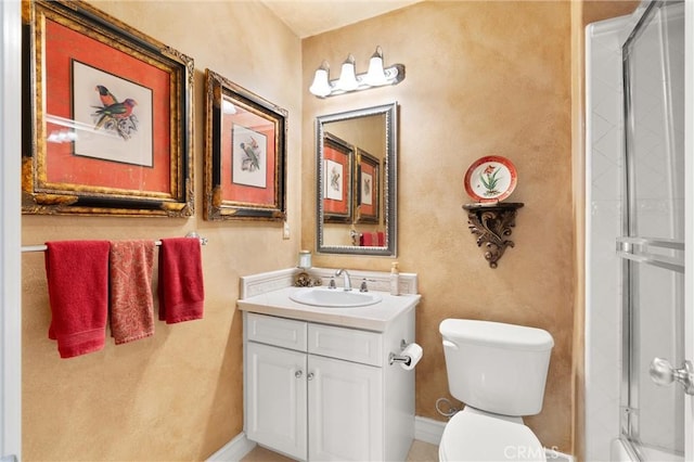 18912 Rockinghorse Ln, Huntington Beach, CA 92648 - bathroom featuring toilet, vanity, a shower with door, and baseboards