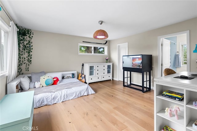 1161 Ravencrest Rd, North Tustin, CA 92705 - bedroom with wood finished floors and multiple windows