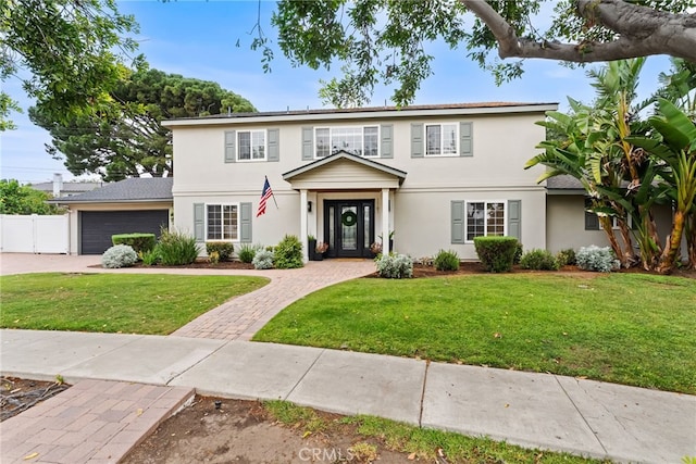 1161 Ravencrest Rd, North Tustin, CA 92705 - view of front of property with stucco siding, a garage, and driveway