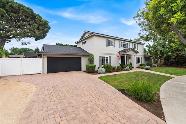 1161 Ravencrest Rd, North Tustin, CA 92705 - view of front of property with stucco siding, an attached garage, and decorative driveway